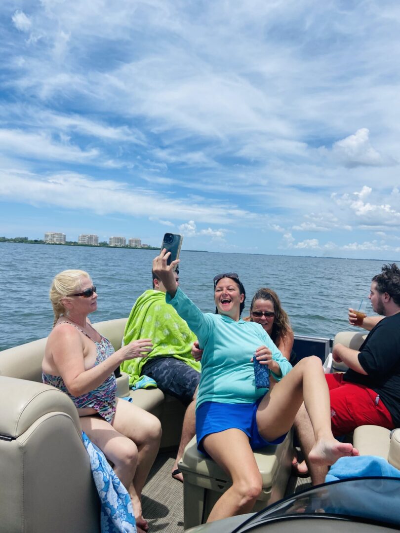 Group of people taking selfie on boat